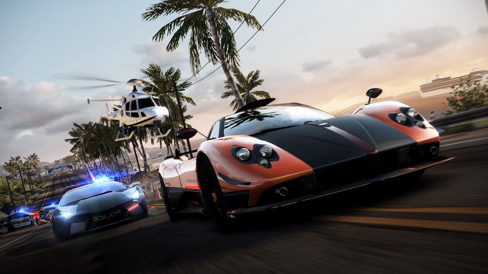 a imagem mostra dois carros, um sendo uma viatura perseguindo uma mclaren em Hot Pursuit