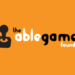 imagem com o logo da AbleGamers escito em letras pretas e brancas a seguinte frase "the ablegamers foundation" em um fundo laranja